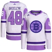 Adidas Matt Grzelcyk Boston Bruins Men's Authentic Hockey Fights Cancer Primegreen Jersey - White/Purple